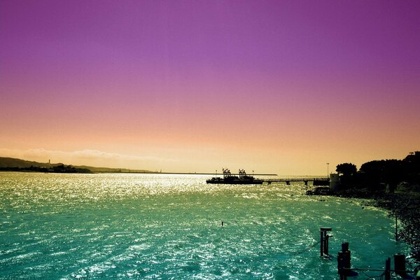 Purple sunset over the azure sea