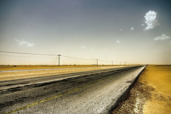 Landscape of a road passing through fields