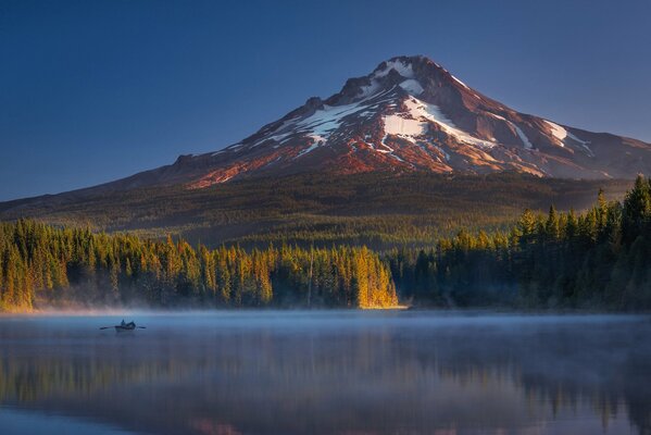 Mountain lake and morning fog