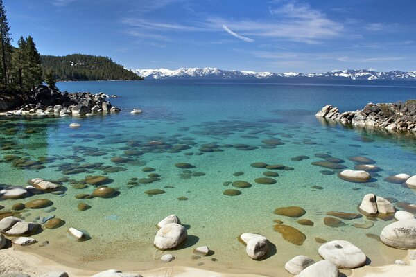 Incredible beauty of the lake and snowy remote mountains