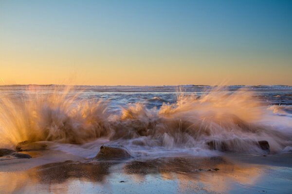 Splashes of a wave breaking on the seashore