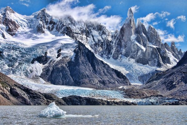 Snow-covered rocks on the ocean shore