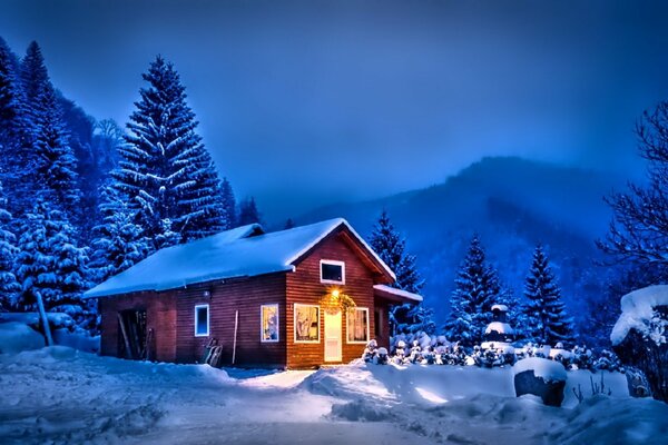 A lonely house in the night by the mountains