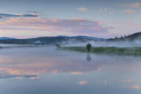 Reflection of clouds in the waters of lilac lake