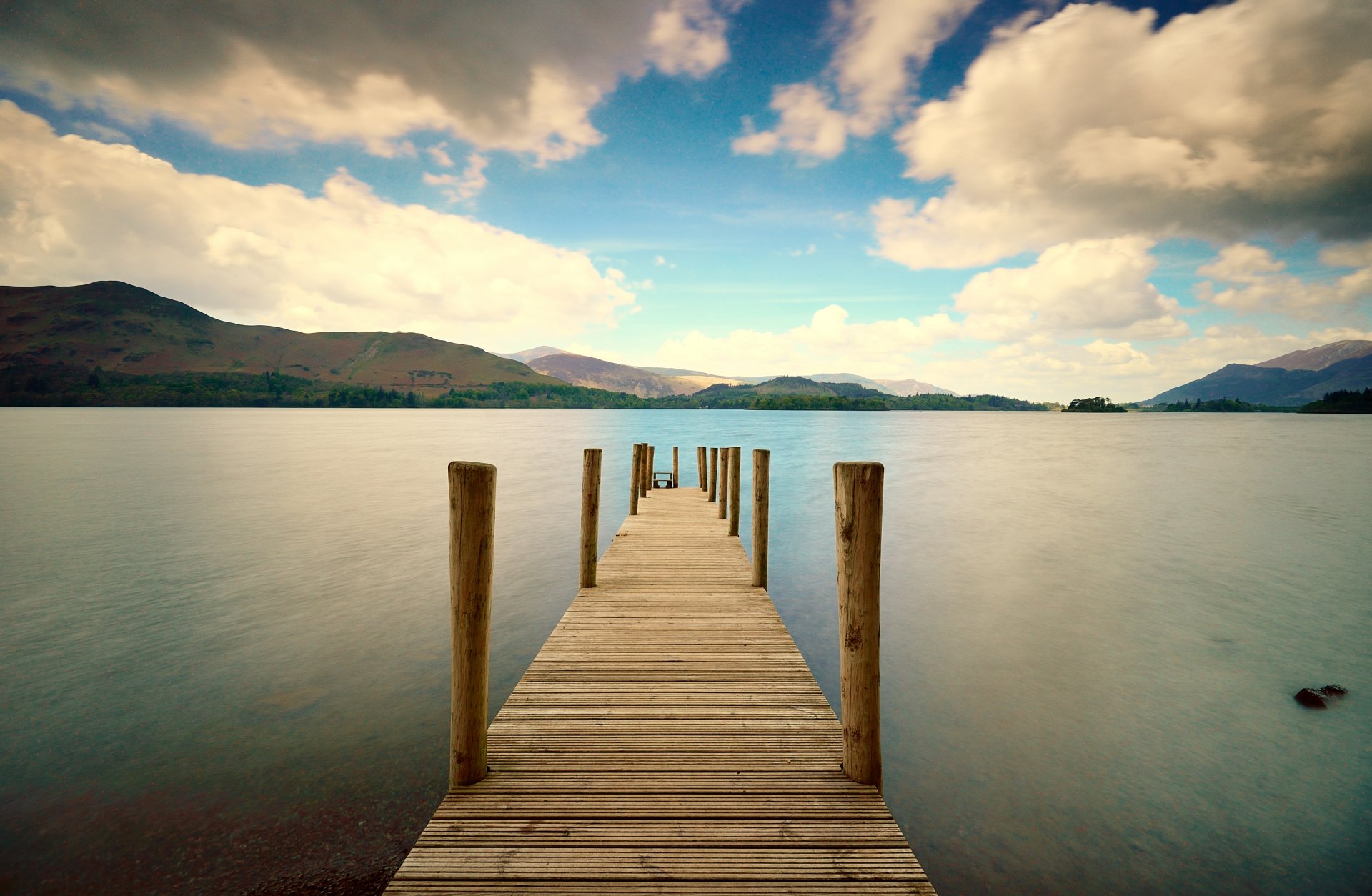 nature pier bridge board sea water hill hills foliage green tree sky clouds background wallpaper widescreen full screen hd wallpapers fullscreen