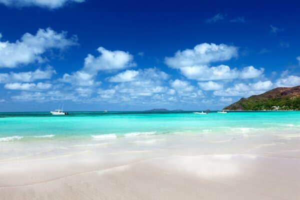 Clouds in the blue sky over the turquoise sea