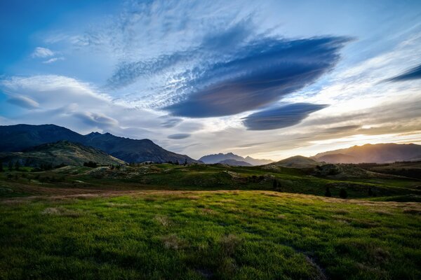 Clouds float along the green valley