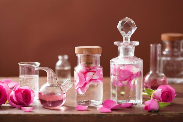 Water with rose petals in glass tubes