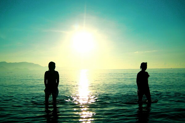 Figures of people on the background of the sea