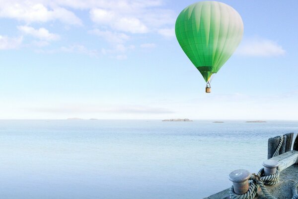 Balloon in the sky on the background of the sea