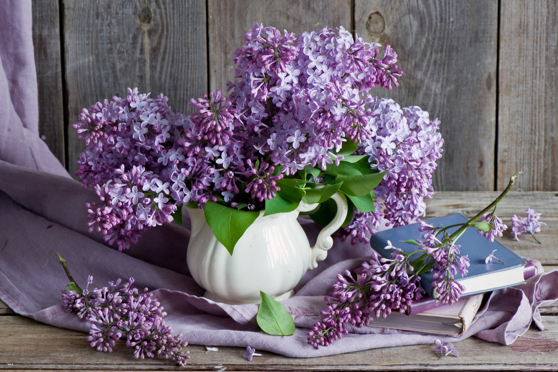 lilac bouquet branches books still life