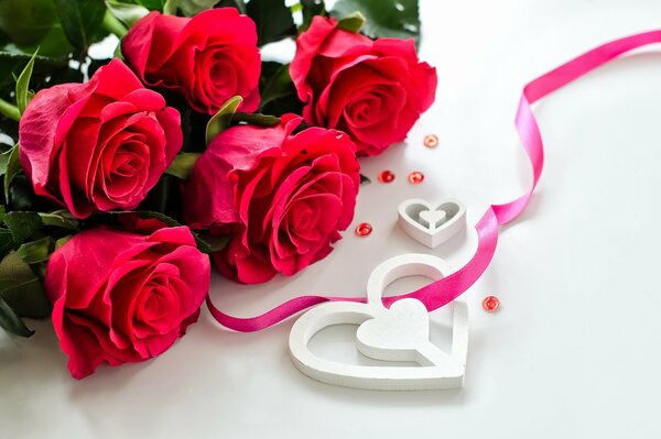 Bouquet of roses on a white background and a heart