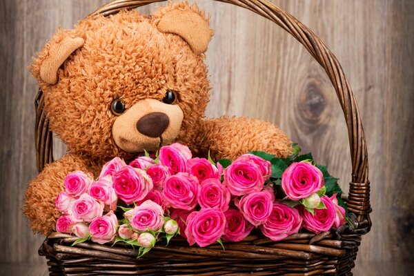 Teddy bear with flowers in a basket