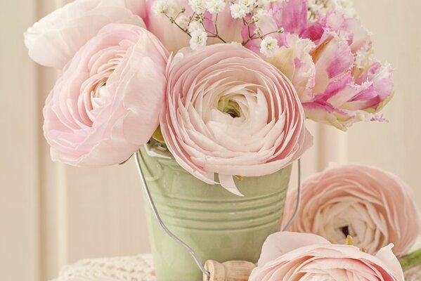 Bouquet of pink roses in a decorative bucket