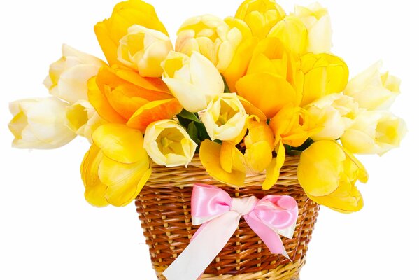 Basket with a bouquet of yellow tulips