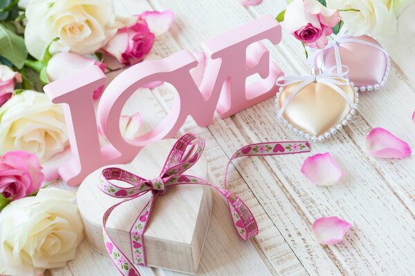 Love still life with gifts and pink inscription