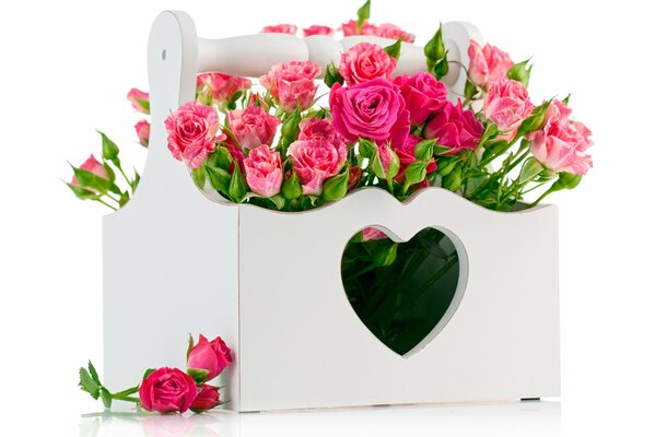 Pink roses with white wooden box with heart