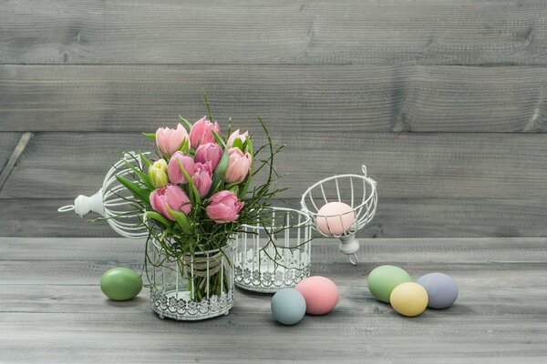 Easter eggs with tulips in a vase