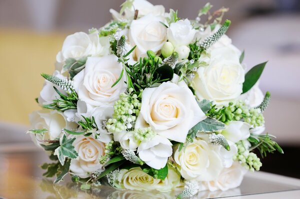 Wedding white bouquet of roses on the table