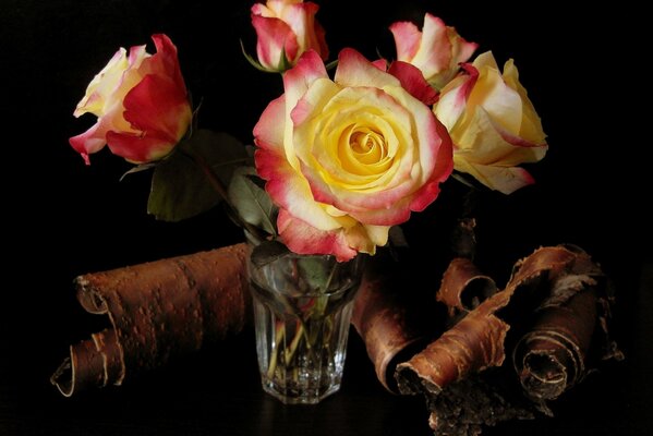 A bouquet of roses standing in a glass