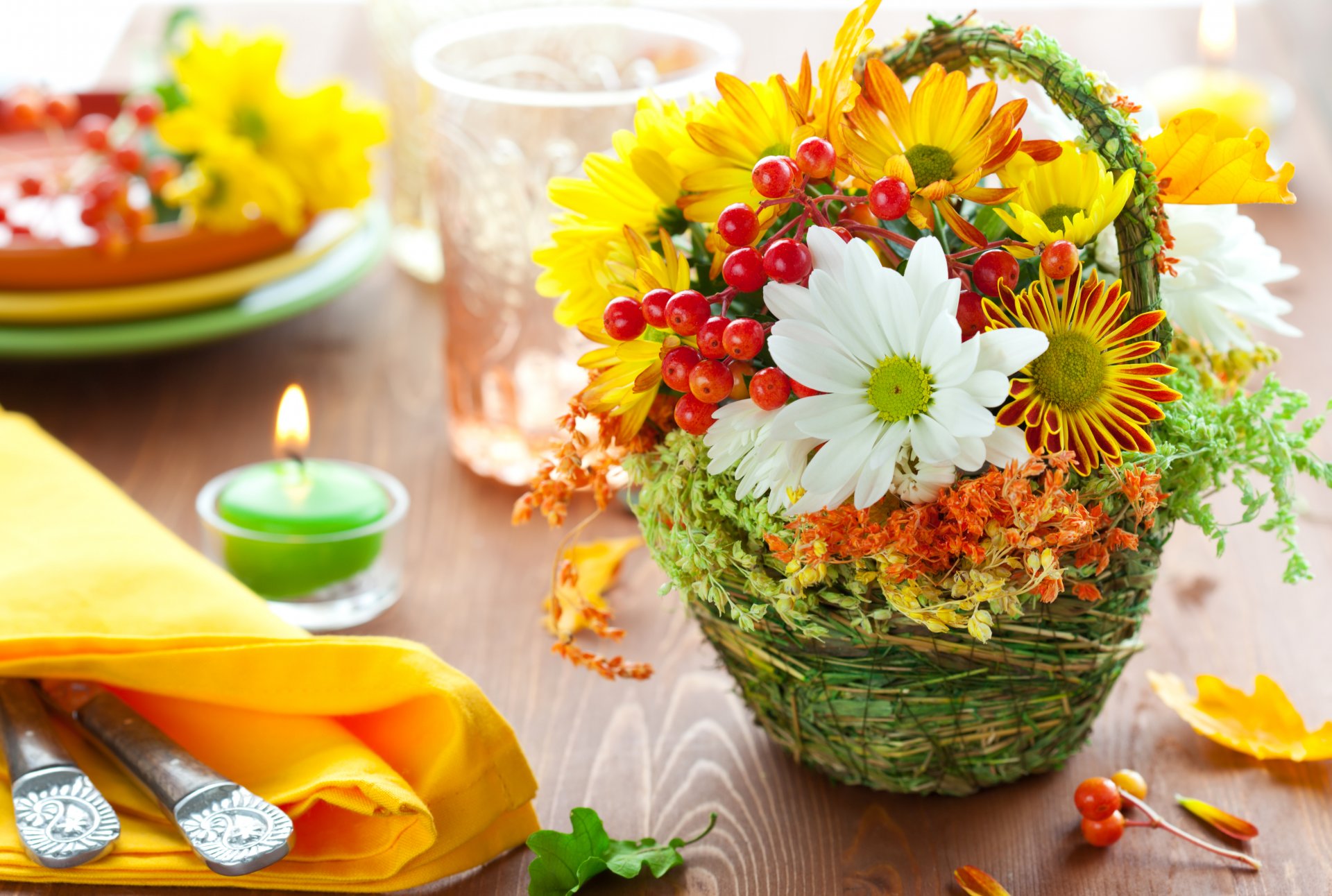 table candle fire napkin cutlery bouquet flower leaves berries rowan