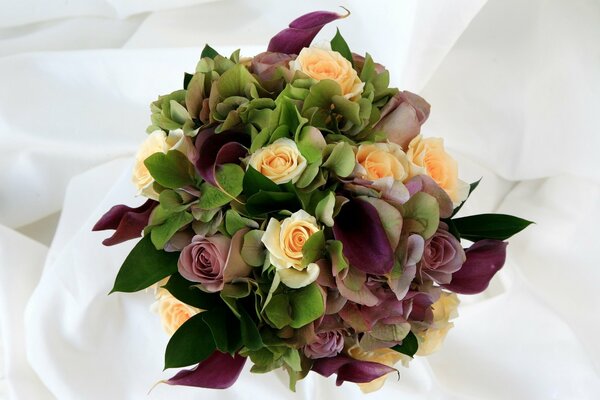 Bouquet of different flowers on a white background