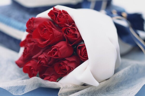 Delicate bouquet of roses on fabric