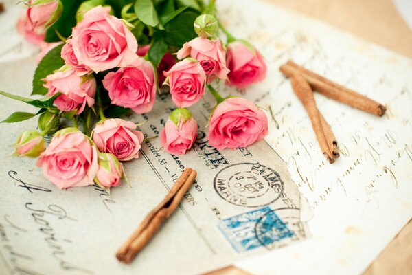 Romantic bouquet of roses on letters