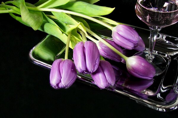 Lilac tulips and a glass of wine