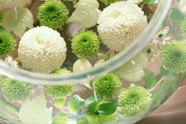 Candles with petals in a vase with water