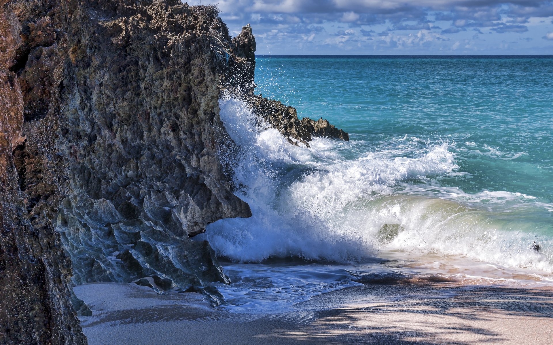 rocce mare onde sabbia schiuma