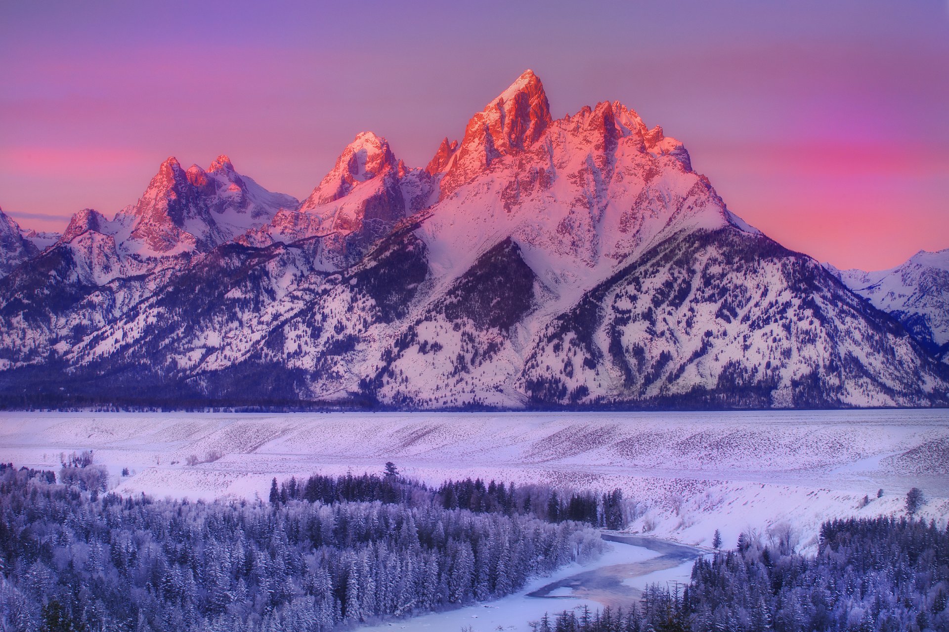 alpenglow sul grand teton-snake river si affaccia sulla strada grand teton national park wyoming montagna parco nazionale inverno neve