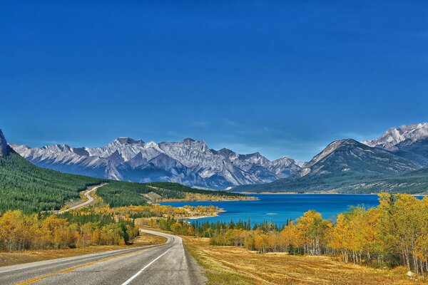 Landscape of the road on the background of the lake and mountains in Abraham