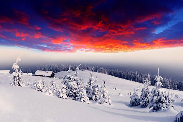 Bright painted sky in snowy mountains