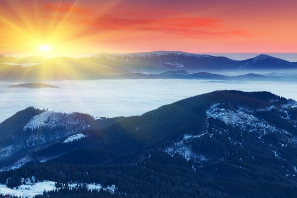 Cold blue hills and an icy river against the background of a warm sunny dawn