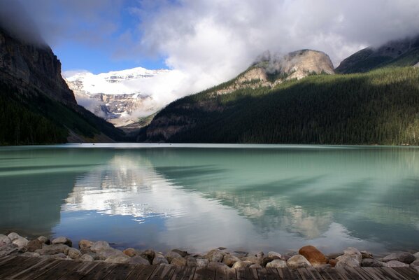 Glacial lake surrounded by majestic rocky mountains