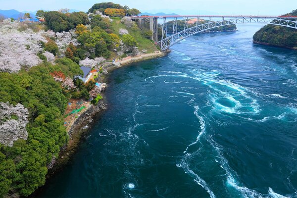 The bridge on the bay in Japan and the river coast