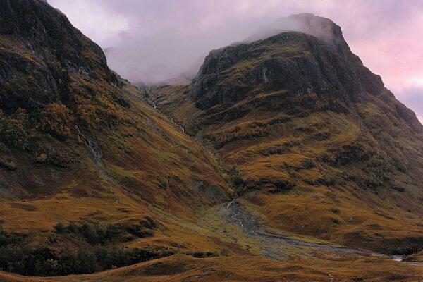 The slope of high mountains, clouds