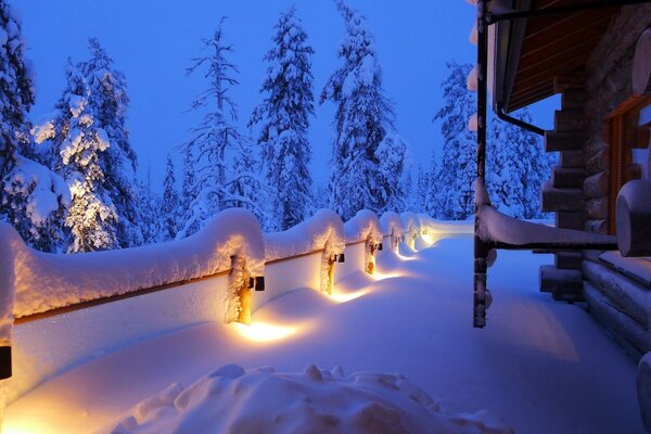 Winter house in a snow-covered forest