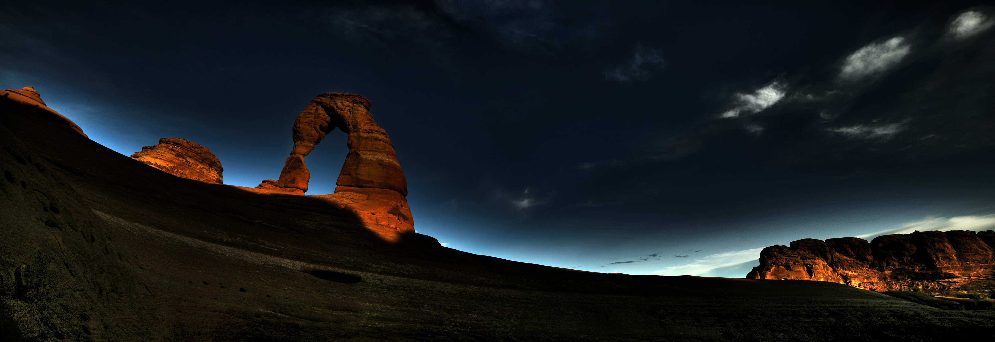 arco roca amanecer noche