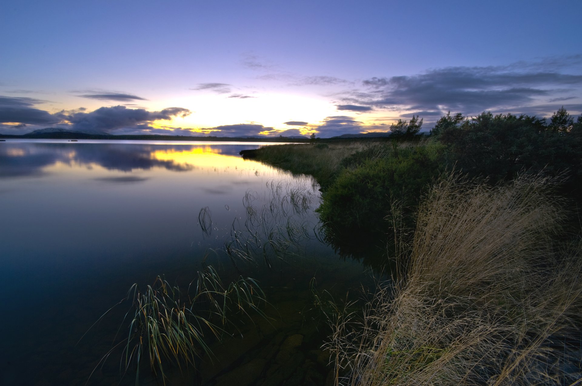 night sunset sky clouds beach grass river water surface of reflection landscape