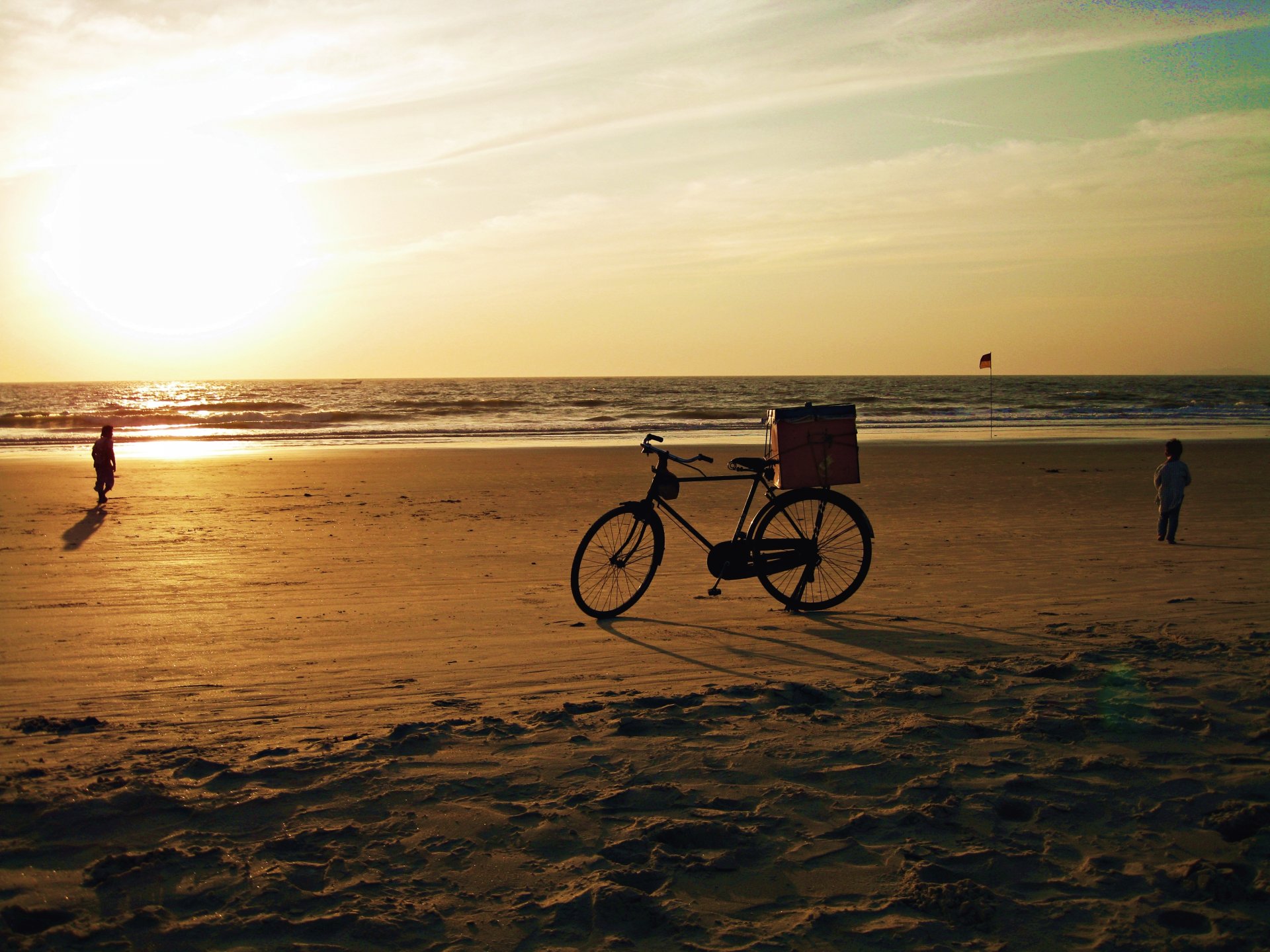 bike sunset sea ocean india goa sand beach children sky sun