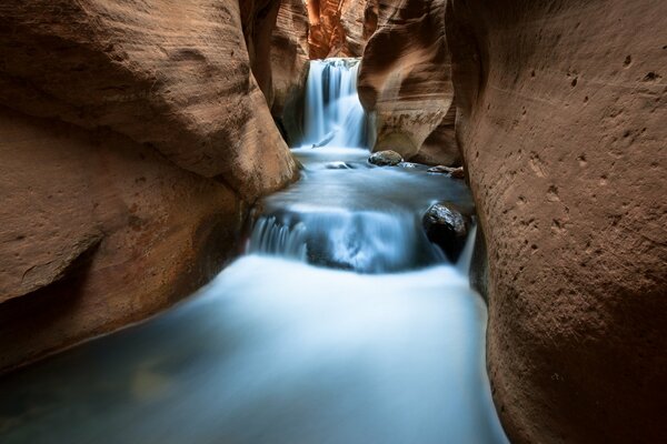 Blue waterfall on rocky rocks