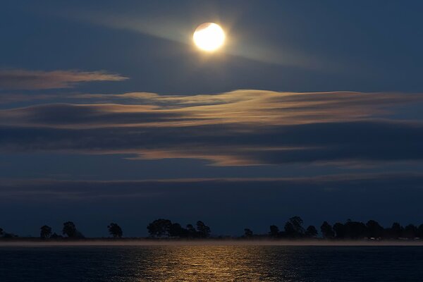 Reflection of the moon in the night lagoon