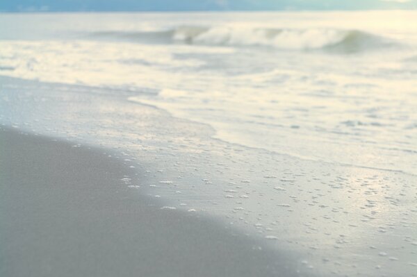 Calm waves wash over the beach