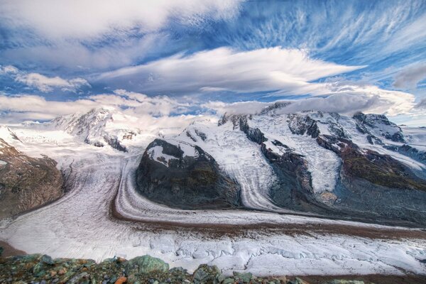 Swiss mountains. Floating clouds