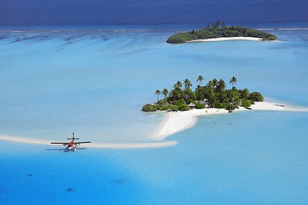 The plane on the background of the purest water