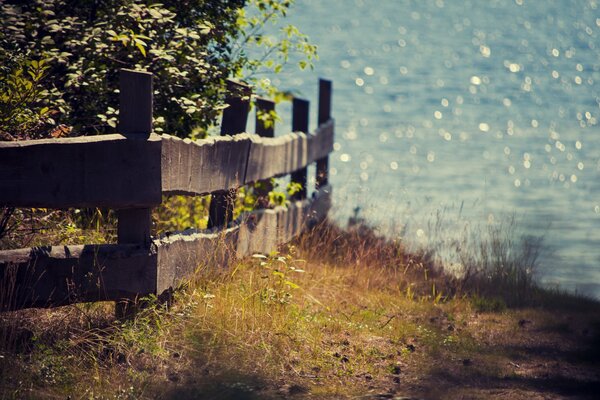 Wooden fence on the background of the sea