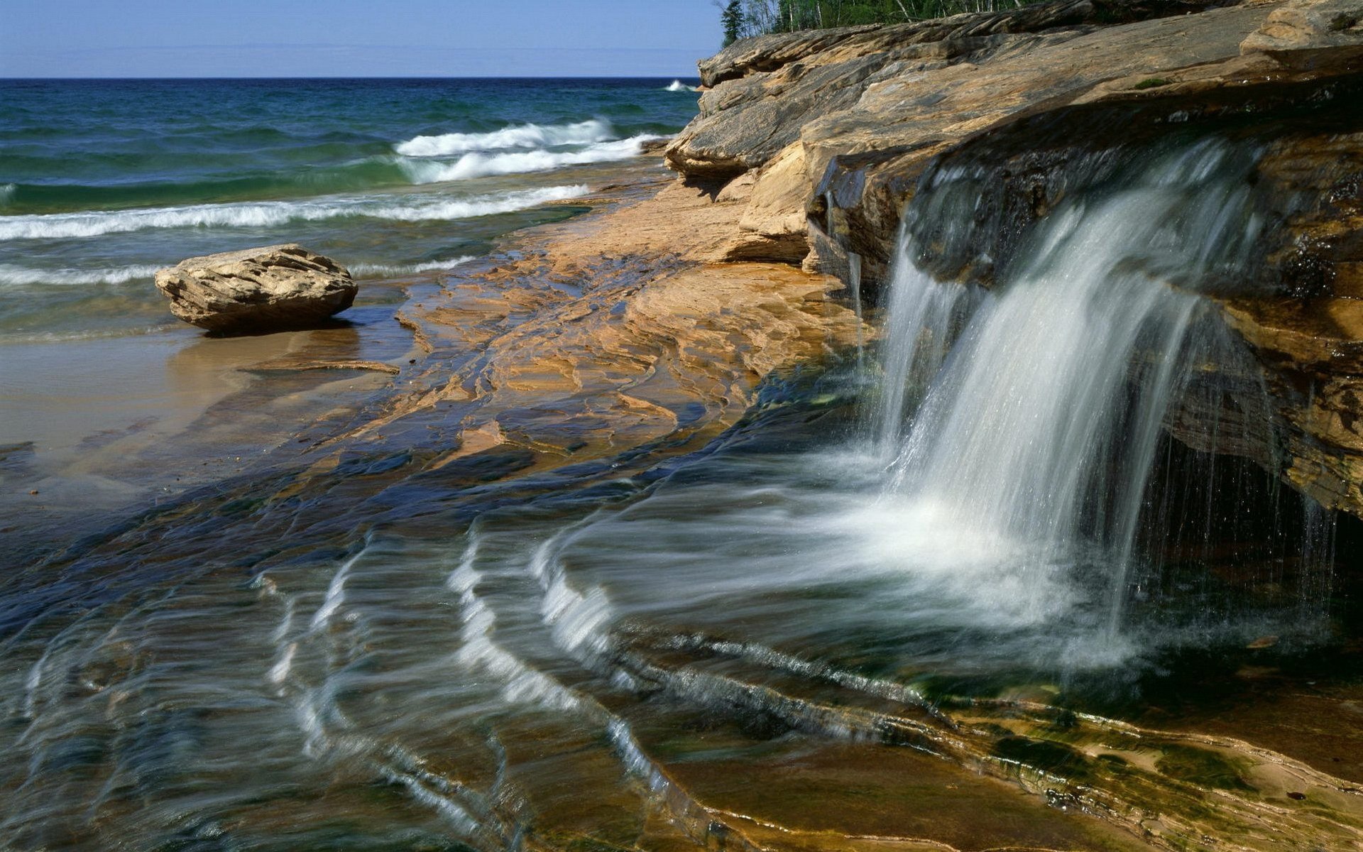 of the jet water waterfall stones beach sea