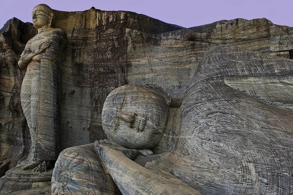 Stone statues of Buddha carved in the rocks